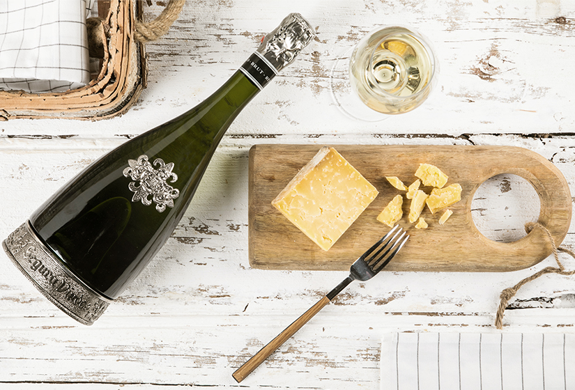 fork with cheese and cava